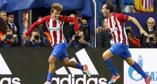  Atletico Madrid striker Antoine Griezmann  celebrates with his team-mate Diego Godin  after scoring the winning goal during the  Champions League Group D against  FK Rostov at Vicente Calderon stadium in Madrid. Photograph: Javier Lizon/EPA