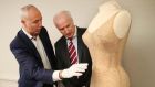 THAT dress: Martin Nolan of Julien’s Auctions and William Doyle of Newbridge Silverware examine Marilyn Monroe’s iconic “Happy Birthday Mr President” number, on display at the Museum of Style Icons and up for auction in Los Angeles. Photograph: Robbie Reynolds