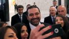 Lebanese prime minister Saad Hariri takes a selfie with journalists at the presidential palace in Baabda, near Beirut. Photograph: Mohamed Azakir/Reuters