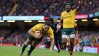 Bernard Foley dives to score during Australia’s 32-8 win over Wales in Cardiff. Photograph: Getty