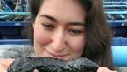 Sinead  holding a sea cucumber at Rossaveal. Photograph: Joe O’Shaughnessy 