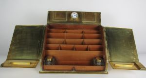 A brass 19th-century stationery box  from Dromoland Castle, with original brass clock,  estimated at €500-€700 