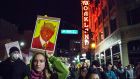 Demonstrators march pass Fox Oakland Theater in protest against President-elect Donald Trump in Oakland, California on Thursday. Photograph: Peter Dasilva/EPA