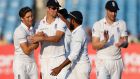 England players celebrate the wicket of Indian batsman Amit Mishra on the third day of the first Test against India in Rajkot, India. Photograph: AP Photo