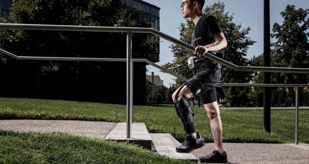 A volunteer using the “soft” robot device that can help help stroke patients to walk again