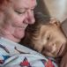 Johanne holds Siobhan who  cannot walk, is non-verbal, does not eat solid food, is doubly incontinent, and has only one kidney. Photograph: Brenda Fitzsimons