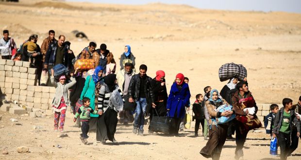 Displaced people in Mosul flee Islamic State on Tuesday. A defeat of the jihadists could trigger conflicts between the forces now attacking it. Photograph: Thaier Al-Sudani/Reuters