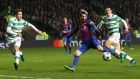  Lionel Messi of Barcelona scores his side’s first goal during the Uefa Champions League Group C match between Celtic and Barcelona at Celtic Park. Photo: Ian MacNicol/Getty Images