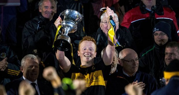 Dr Crokes’ Johnny Buckley breaks the handle of the cup after lifting it up. Photograph: Cathal Noonan/Inpho