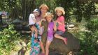 Jennifer Kelly and her three children in the Gold Coast Regional Botanic Gardens. 
