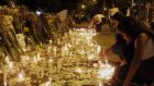 People light candles outside the Atanasio Girardot Stadium after an event commemorating the victims of a plane crash in Medellin. Photograph: Luis Eduardo Noriega/EPA