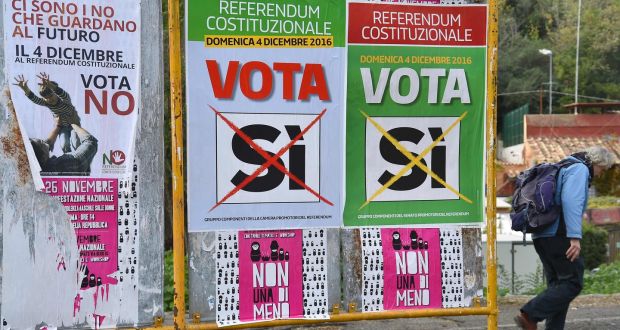 A man walks past referendum campaign posters  in Rome on Friday. Photograph: Vincenzo Pinto/AFP/Getty 