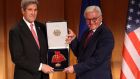 US secretary of state John Kerry   receives the Federal Cross of Merit  award from German foreign minister Frank-Walter Steinmeier  in Berlin, Germany.  Photograph: Adam Berry/Getty  