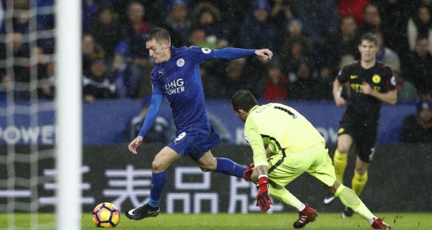 Leicester City striker Jamie Vardy  takes the ball around Manchester City goalkeeper Claudio Bravo on his way to scoring his third goal during the English Premier League match  at King Power Stadium. Photograph: Adrian Dennis/AFP/Getty Images