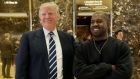 President-elect Donald Trump and Kanye West pose for a picture in the lobby of Trump Tower in New York. Photograph:Seth Wenig/AP