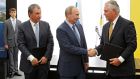Russia’s president Vladimir Putin, Rosneft chief executive Igor Sechin (left) and Exxon Mobil chief  Rex Tillerson take part in a signing ceremony at a Rosneft refinery in the Black Sea town of Tuapse, Russia, on  June 15th, 2012. Photograph:  Sputnik/Kremlin/Mikhail Klimentyev via Reuters