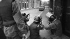 10th July 1970: British soldiers take aim at civil rights demonstrators in the Falls Road, Belfast. File photograph: Malcolm Stroud/Express/Getty Images