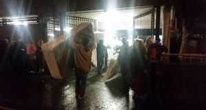 Protesters moving in mattresses last night for the occupation of Apollo House Photograph: Kitty Holland