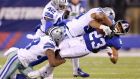 New York Giants’ Rashad Jennings (23) is tackled by Dallas Cowboys’  Brandon Carr (39) and  Anthony Hitchens (59) in the recent clash at MetLife Stadium. Photograph:  Brad Penner-USA TODAY 