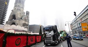 The truck used in the attack is towed away as forensic experts examine the scene. Photograph: Getty Images 