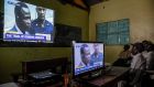 People watch on TV the screening of the start of the ICC  trial of former Lord’s Resistance Army commander Dominic Ongwen who is facing  charges of war crimes and crimes against humanity in Uganda. Photograph: Isaac Kasamani/AFP/Getty Images