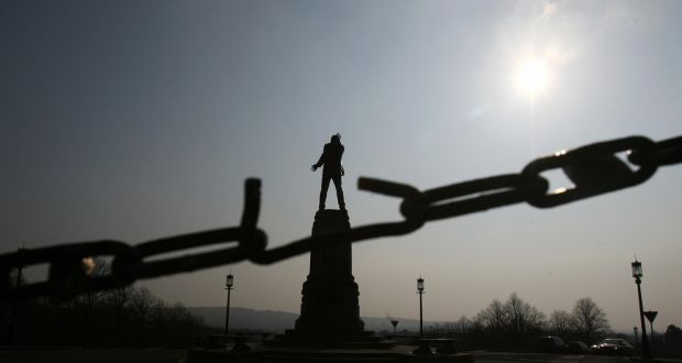 The statue of Sir Edward Carson, a leader of the Irish unionists, seen through a broken link at the Stormont Assembly building in Belfast. Photograph: Adrian Dennis/AFP/Getty