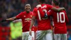 Anthony Martial, Marcus Rashford and Wayne Rooney helped Manchester United to a comfortable 4-0 win over Reading. Photograph: Getty/ Clive Brunskill