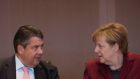 Germany’s deputy chancellor and economics minister Sigmar Gabriel with the chancellor, Angela Merkel. Photograph: Steffi Loos/AFP/Getty