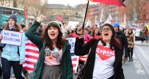 Grace de Blaca from Dublin (left) and Lo Storm from Minnesota, taking part in the Women’s March in Dublin. Photograph: Dara Mac Dónaill