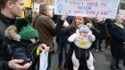 Sarah Jane O’ Regan from Ashbourne, with her twins Louisa and Conor, and friend Joey Watson, taking part in the Women’s March in Dublin on Saturday. Photograph: Dara Mac Dónaill
