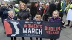 Alana Kirk with her children Daisy (11), Poppy (9) and Ruby (6), taking part in the Women’s March in Dublin. Photograph: Dara Mac Dónaill 