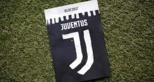 The new logo of Juventus football club is pictured on a flyer before the Italian Serie A football match against  Lazio on Sunday. Photograph: Marco Bertorello/AFP/Getty Images