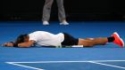 Rafael Nadal falls onto the court as he celebrates winning  a sensational men’s singles semi-final  against Bulgaria’s Grigor Dimitrov at the Australian Open in Melbourne. Photograph: Issei Kato/Reuters 