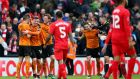 Wolves players celebrate their victory at Anfield. Photograph: Alex Livesey/Getty Images