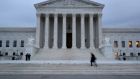 A man walks up the steps of the US supreme court  in Washington, DC on Tuesday.  President Donald Trump is due to announce his nomination to fill a year-long vacancy on the court. Photograph: Mark Wilson/Getty Images