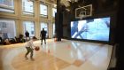 Playing basketball at a  Nike store in New York: Nike was dragged down 1.3 per cent. Photograph: Jennifer S Altman/The New York Times