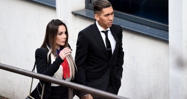 Liverpool footballer  Roberto Firmino arriving at Liverpool City Magistrates Court with his wife Larissa Pereira where he was  fined £20,000 and banned from driving for a year after admitting drink-driving. Photograph:  Peter Byrne/PA Wire