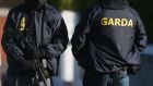 Armed gardaí on patrol in Dublin in a bid to curb gangland violence. Photograph: PA 