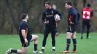 Rhys Webb of Wales talks with team mates Rob Evans and Sam Davies during a training session in Cardiff. Photo: Michael Steele/Getty Images