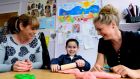 Luke McArdle with his mother Lynn, left, and  pre-school co-manager Margaret Hennessy at  Beaumont Community Pre-school. Photograph: Cyril Byrne
