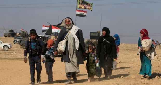 Displaced Iraqis flee their homes during a battle between Iraqi forces and Isis in western Mosul. Photograph: Alaa Al-Marjani/Reuters