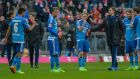 Hamburg players stand on the pitch following their  8-0 Bundesliga defeat  to  Bayern Munich at the Allianz Arena. Photograph: Günter Schiffmann/AFP/Getty Images