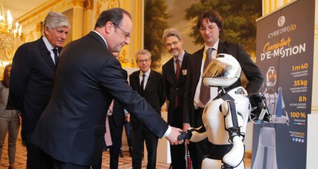 French president François Hollande shakes hands with Cybedroid robot Leenby at the Élysée Palace in Paris during the Viva Technology conference. Photograph: Michel Euler/AFP/Getty Images