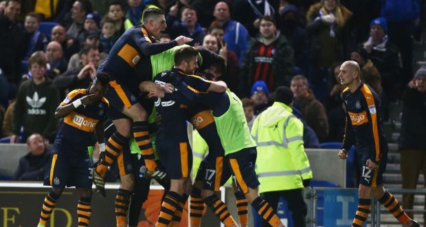 Ayoze Perez is mobbed by his Newcastle team-mates after scoring the winning goal in the Championship match against Brighton  at the Amex Stadium. Photograph: Jordan Mansfield/Getty Images