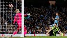 Sergio Agüero scores Manchester City’s fourth goal during the FA Cup fifth-round replay at the Etihad Stadium. Photograph: Phil Noble/Reuters/Livepic
