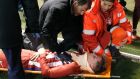 Atletico Madrid’ s striker Fernando Torres gets medical assistance during their draw with Deportivo La Coruna. Photo: EPA