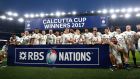 England celebrate their Calcutta Cup victory over Scotland, a result which secured the Six Nations title. Photograph: Michael Steele/Getty