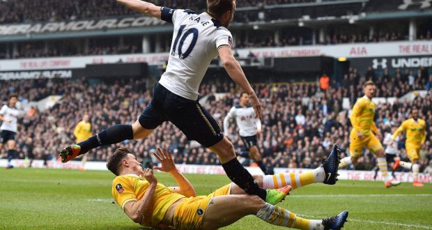 Harry Kane suffered an ankle injury in this tackle  by Millwall’s Jake Cooper during the FA Cup quarter-final at White Hart Lane. Photograph: Glyn Kirk/AFP/Getty Images
