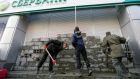 Activists build a wall to block entrance to the Sberbank of Russia office during a protest outside a branch in Kiev on March 13th.  Photograph: Sergey Dolzhenko