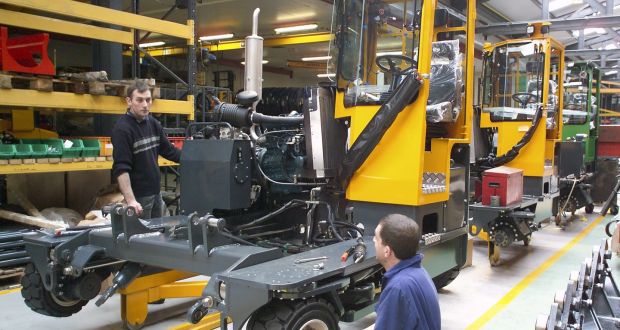 Employees  at Combilift’s facility in Co Monaghan: the firm is to deliver 50 Aisle-Master forklifts to  Kingfisher later this year 